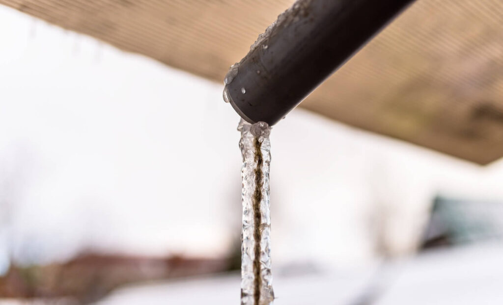 frozen water flowing from a pipe