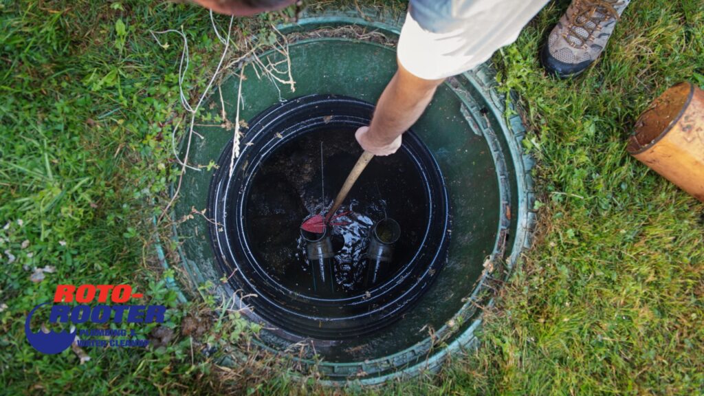Mobile plumber inspecting a septic tank for repair